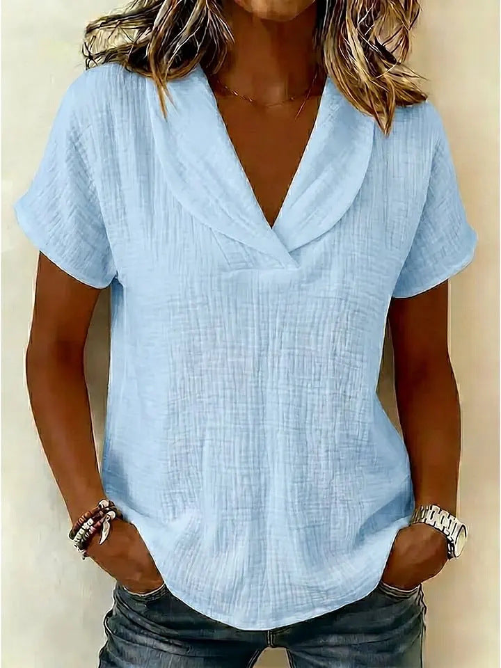 Women's knitted short-sleeve butterfly collar top by Plush Fashion Hub, casualwear with a delicate butterfly design and soft knit fabric.