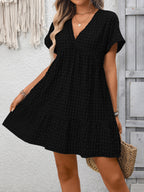 Lightweight plaid V-neck mini dress with ruffle hem by Plush Fashion Hub, perfect for seasonal fashion and casual wear.