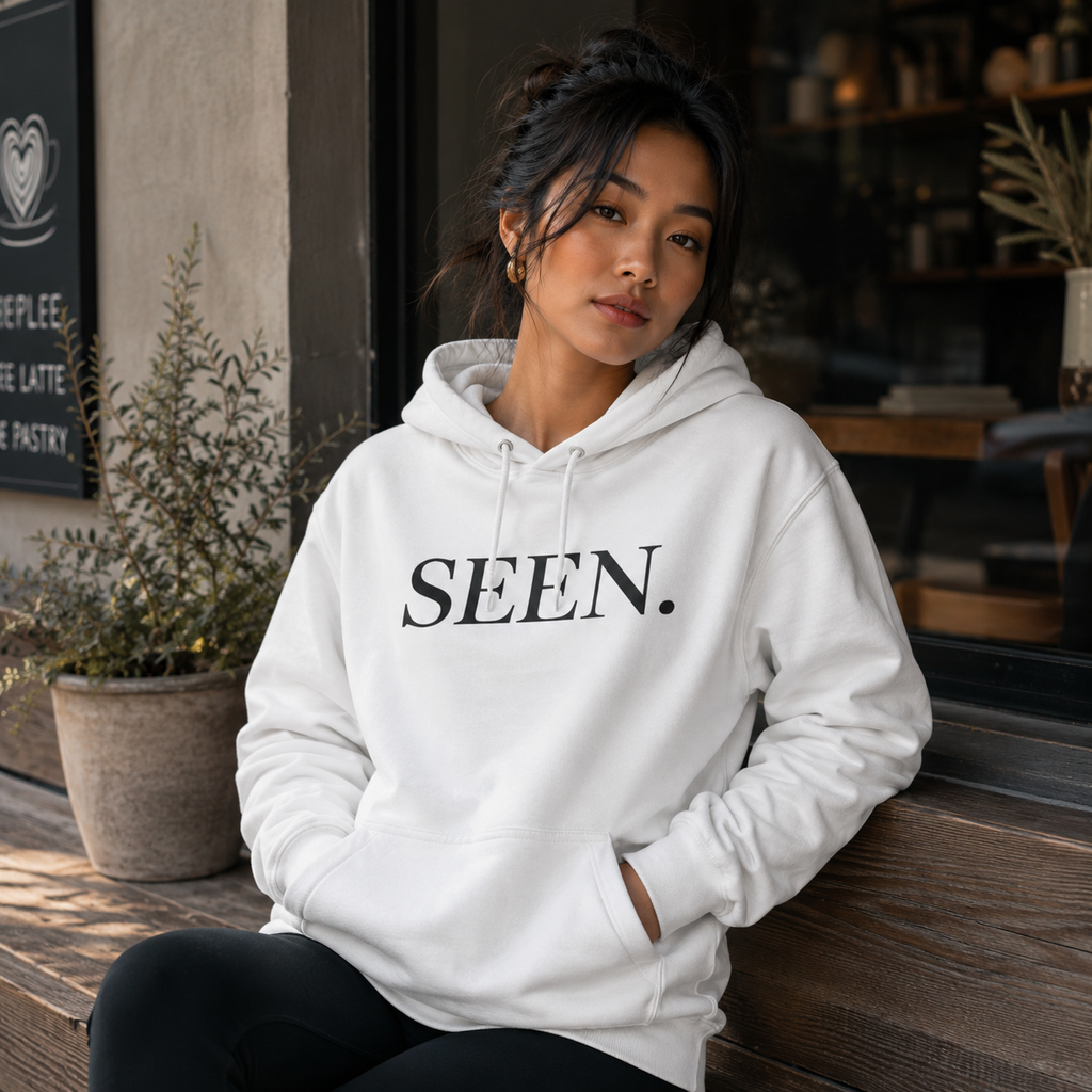 Black Ink Edition SEEN. hoodie by Wear Your Worship, featuring a comfortable black hoodie with subtle branding and a relaxed fit.