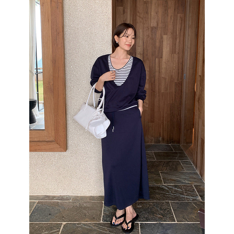 Cozy Chic Faux two-piece hoodie and drawstring skirt set by Plush Fashion Hub, featuring soft fabric and casual style.