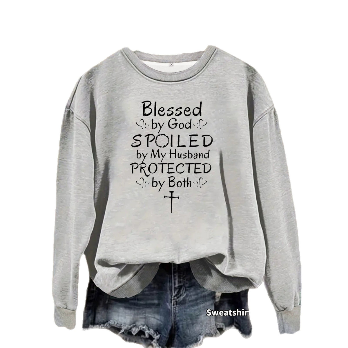 Grey crewneck sweatshirt featuring black text reading "Blessed by God, SPOILED by My Husband, PROTECTED by Both".