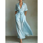 Women's solid color waist-slimming maxi dress with flip collar by FitiqueFit, featuring a sleek, figure-enhancing silhouette.
