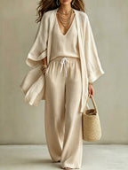 Women's 3-piece cardigan, sleeveless vest, and wide-leg pants set by Plush Fashion Hub, featuring a stylish matching ensemble.