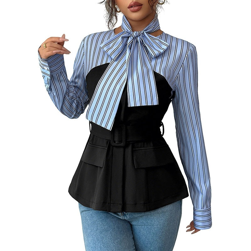 Blue and white striped blouse with black peplum vest, bow tie neck, and belted waist.