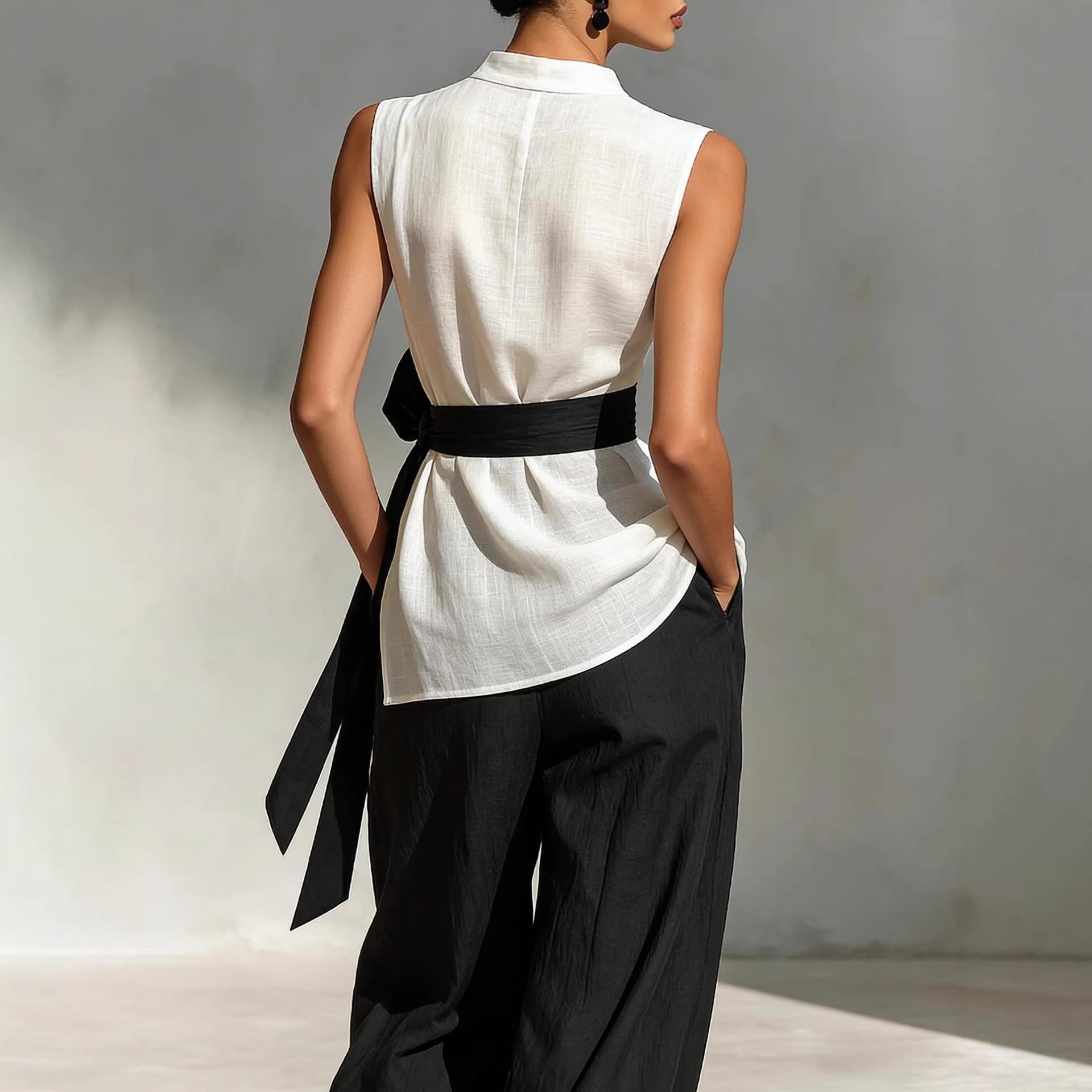 White women's lace-up sleeveless top and wide-leg pants two-piece casualwear set from Plush Fashion Hub, shown on a model.