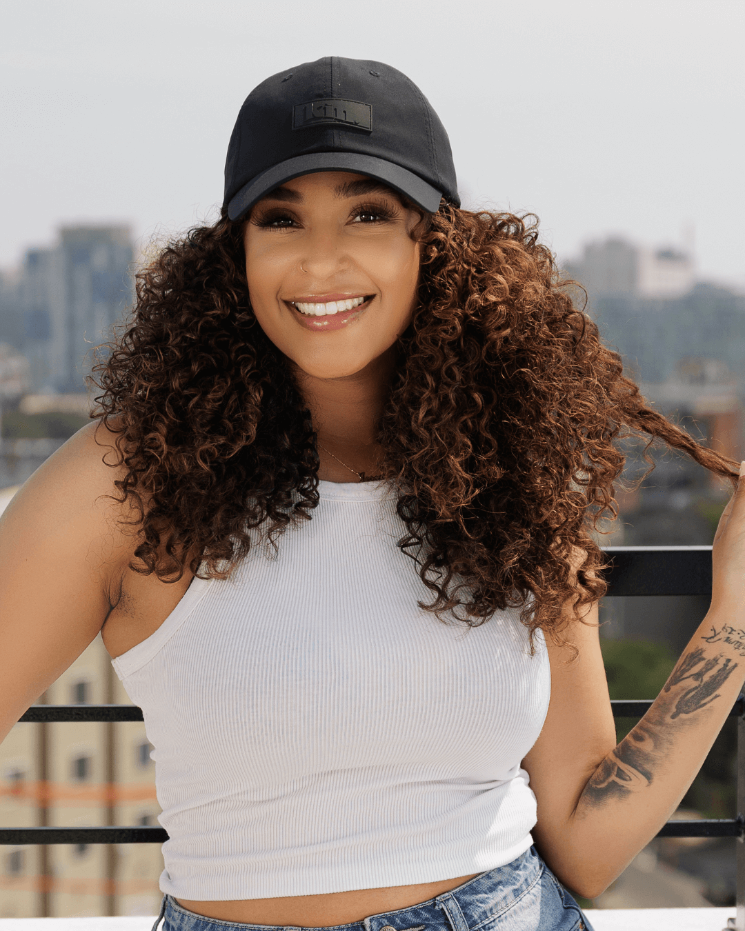 Black waterproof satin-lined dad hat with adjustable strap, featuring plush fashion details and a casual, stylish look.