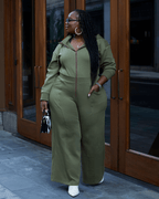 Green satin-lined jumpsuit by Plush Fashion Hub featuring long sleeves and a fitted silhouette.