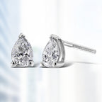 14K white gold pear-shaped solitaire lab-grown diamond stud earrings with F-G color and VS2-SI1 clarity, showcasing elegant jewelry.