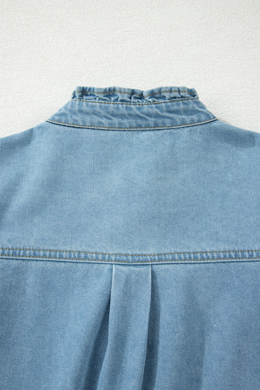 Threaded Pear Sasha short sleeve mini dress displayed on a hanger, featuring a stylish casual design perfect for summer wear.