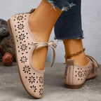 Floral cutout tied slip-on sandals by Plush Fashion Hub featuring open toes and decorative floral accents.