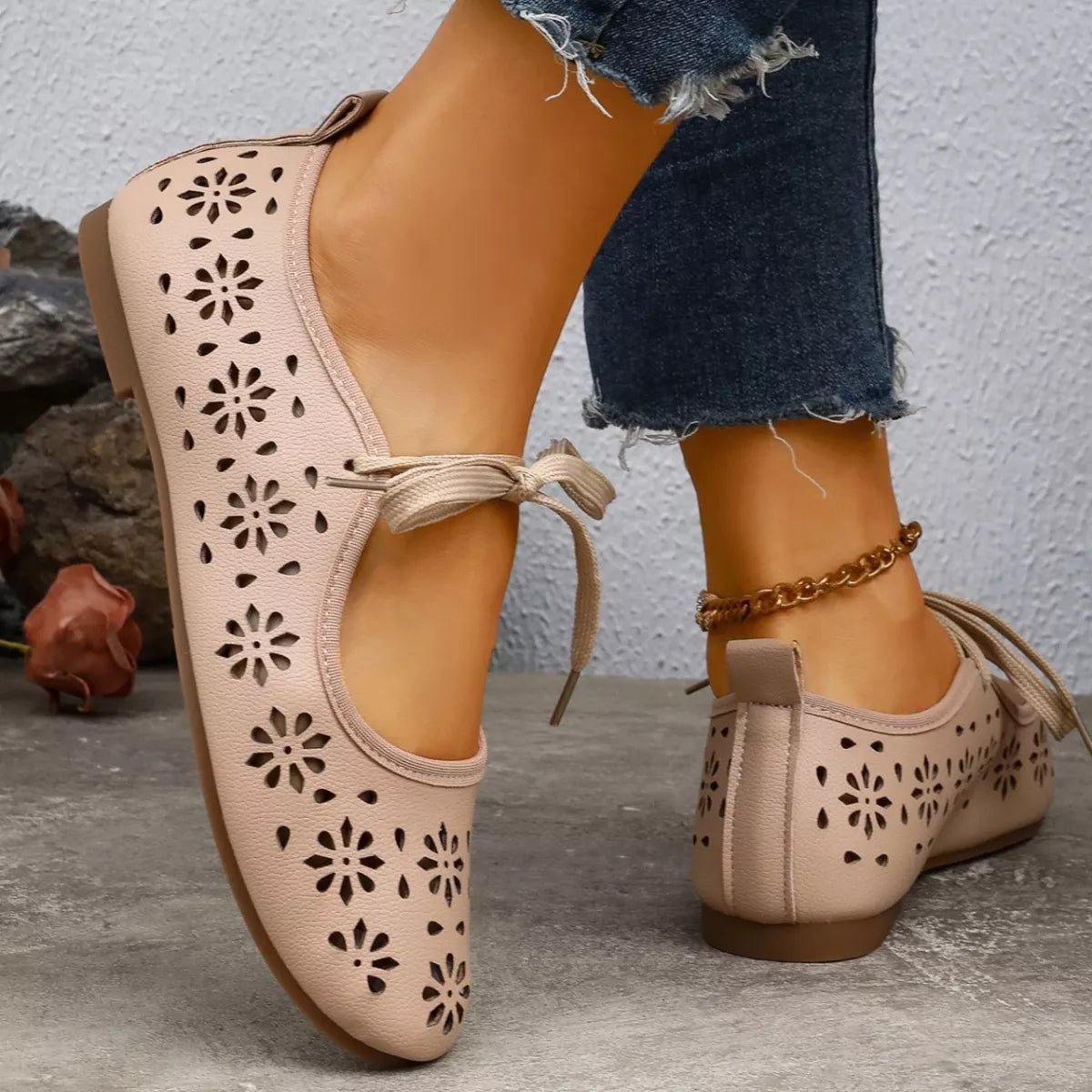 Floral cutout tied slip-on sandals by Plush Fashion Hub featuring open toes and decorative floral accents.