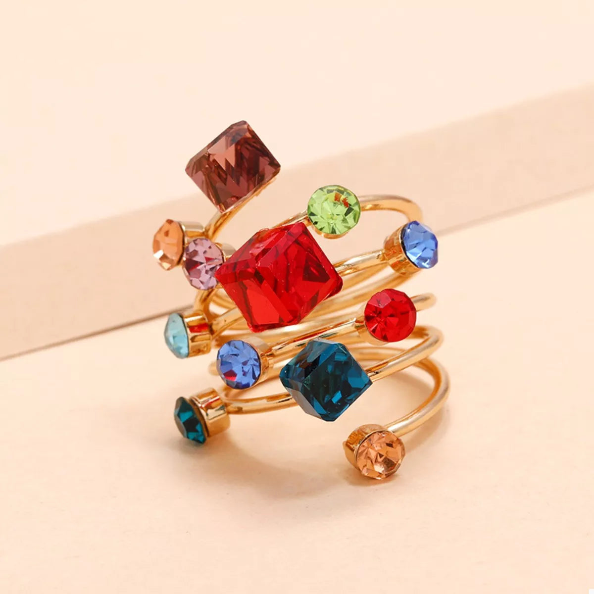 18K gold-plated multi-layered ring showcasing delicate bands and intricate design, perfect for stylish accessorizing.