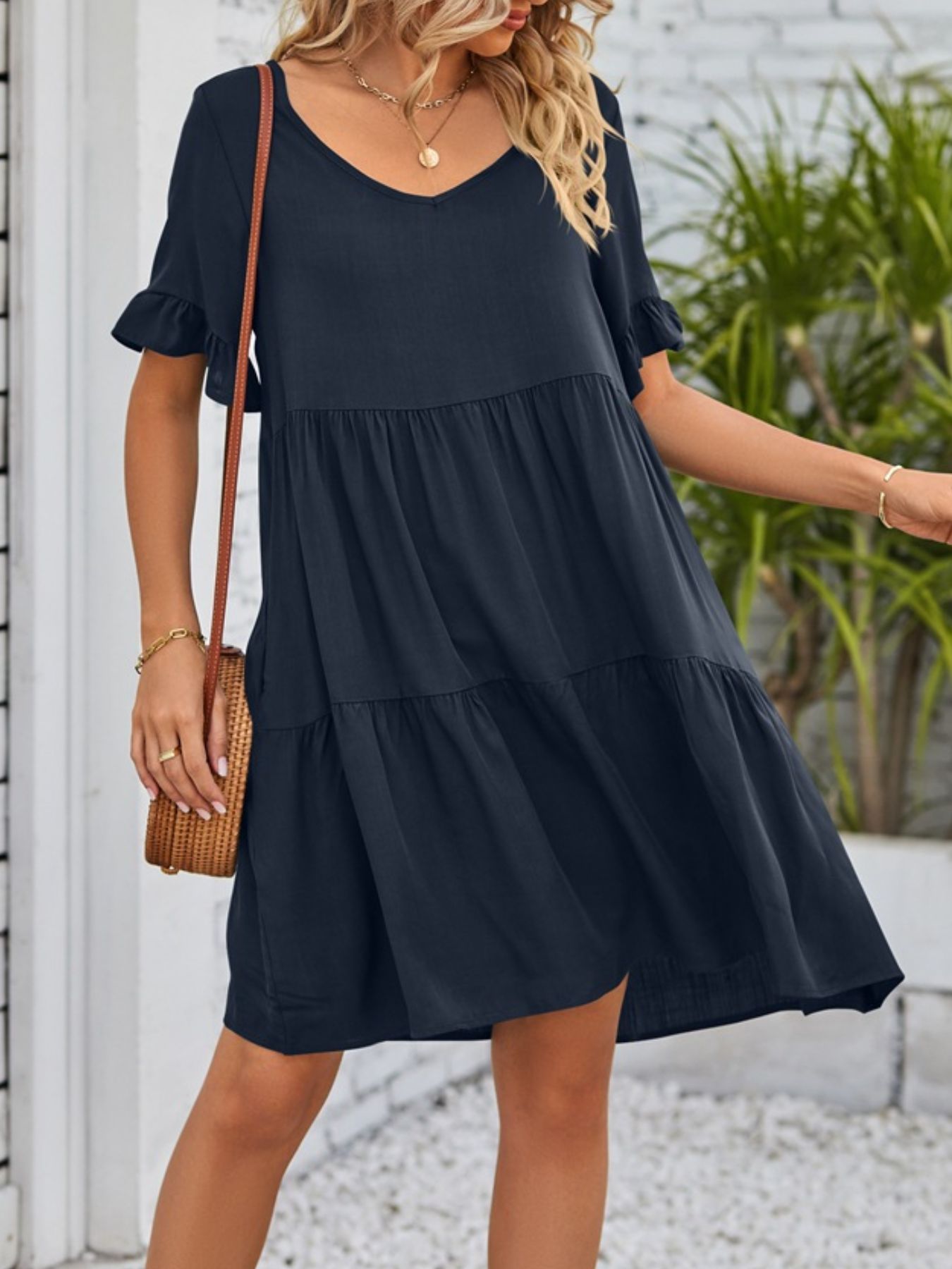 Lightweight rayon ruffled sleeve tiered mini dress with pockets, stylish and feminine design by Trendsi.