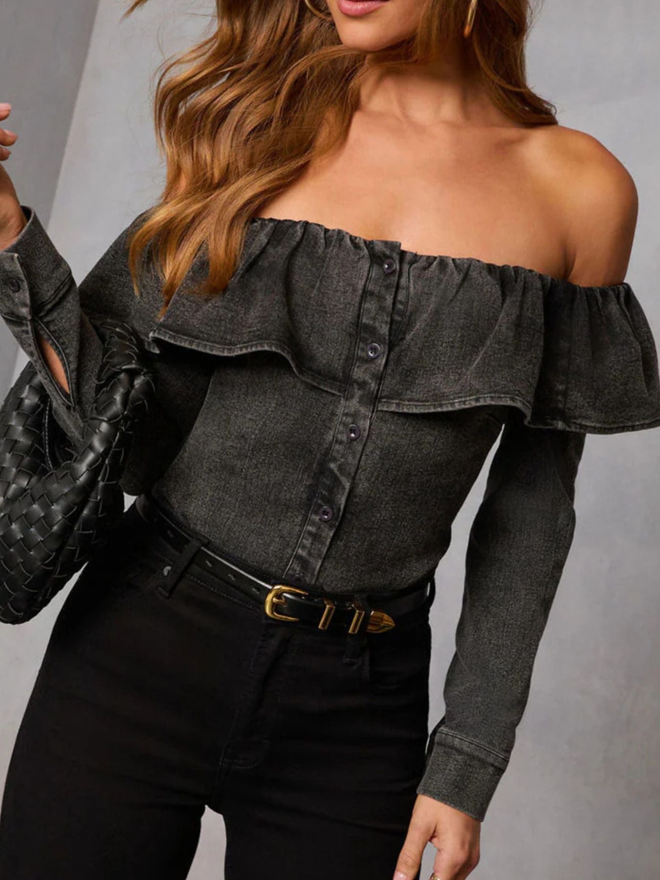 Women's off-shoulder ruffled denim blouse in soft blue, casual trendy top with long sleeves and ruffle details.