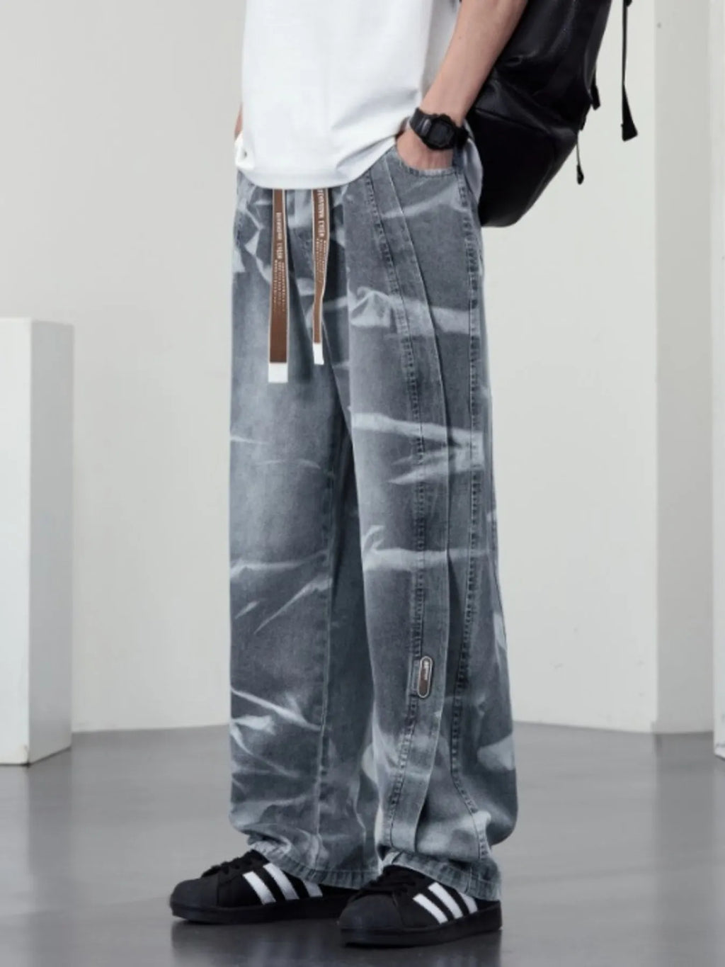 Men's plus size washed wide-leg jeans by Trendsi, showing the relaxed fit and faded denim fabric.