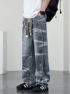 Men's plus size washed wide-leg jeans by Trendsi, showing the relaxed fit and faded denim fabric.