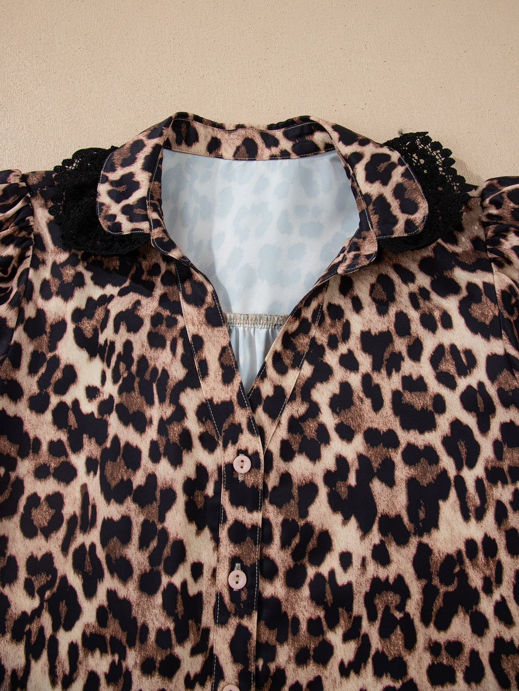 Leopard print short sleeve blouse by Plush Fashion Hub with lace trim and button front, stylish women's tops.