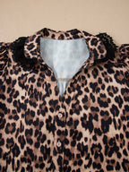 Leopard print short sleeve blouse by Plush Fashion Hub with lace trim and button front, stylish women's tops.