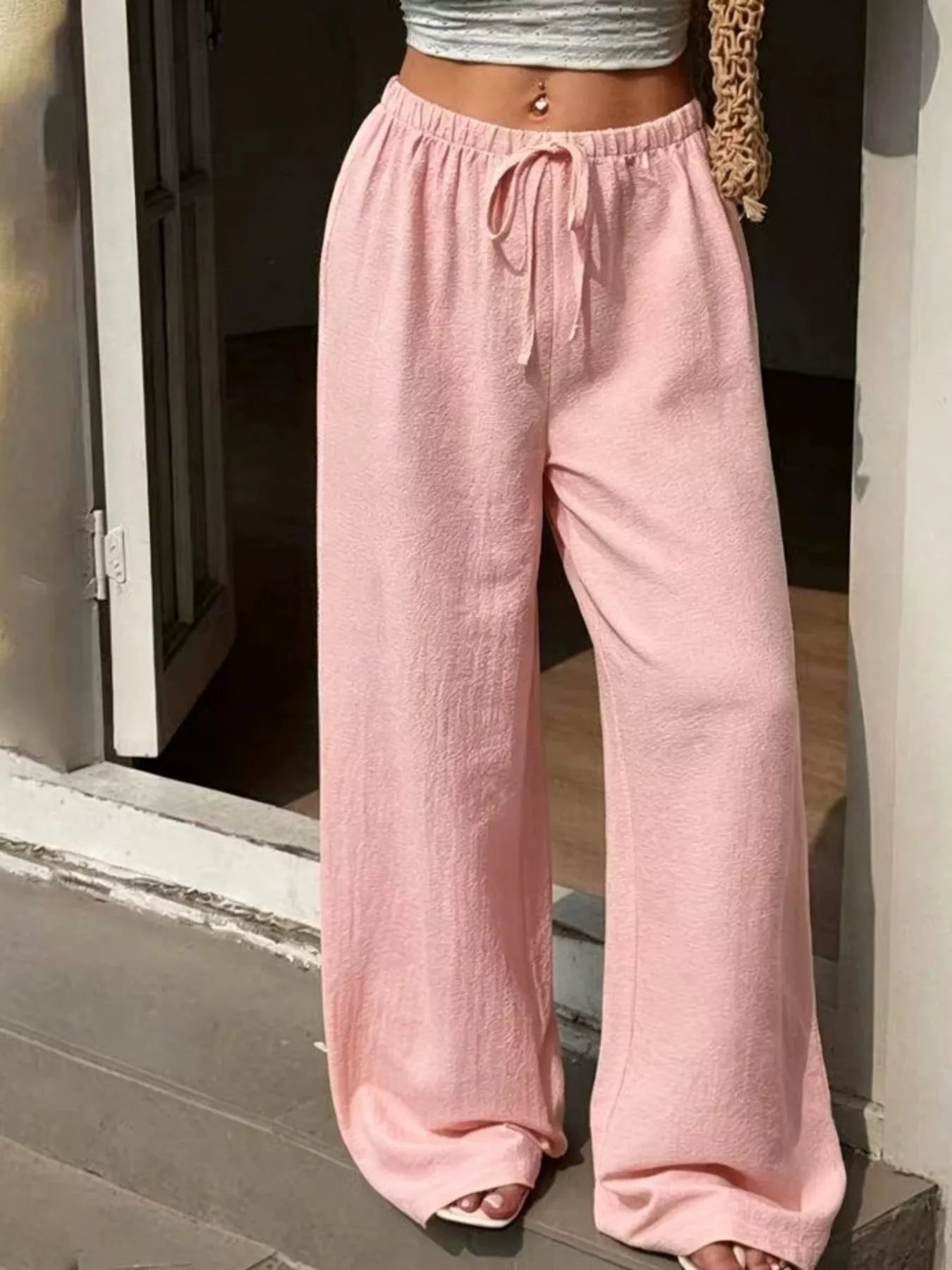 Plus size high-waisted wide-leg pants by Shopimist, featuring a relaxed fit and flowy fabric, shown in a natural pose.