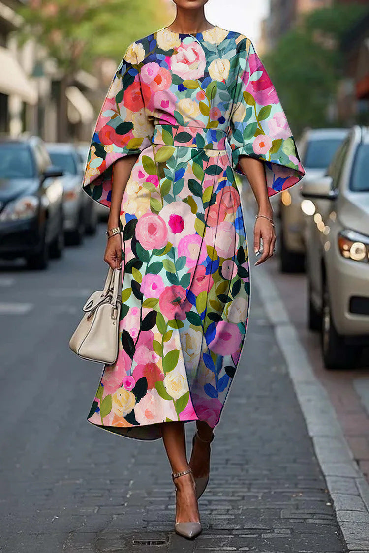 Geometric print batwing sleeve flowy maxi dress by Plush Fashion Hub, casualwear, showcasing the dress's pattern and relaxed fit.