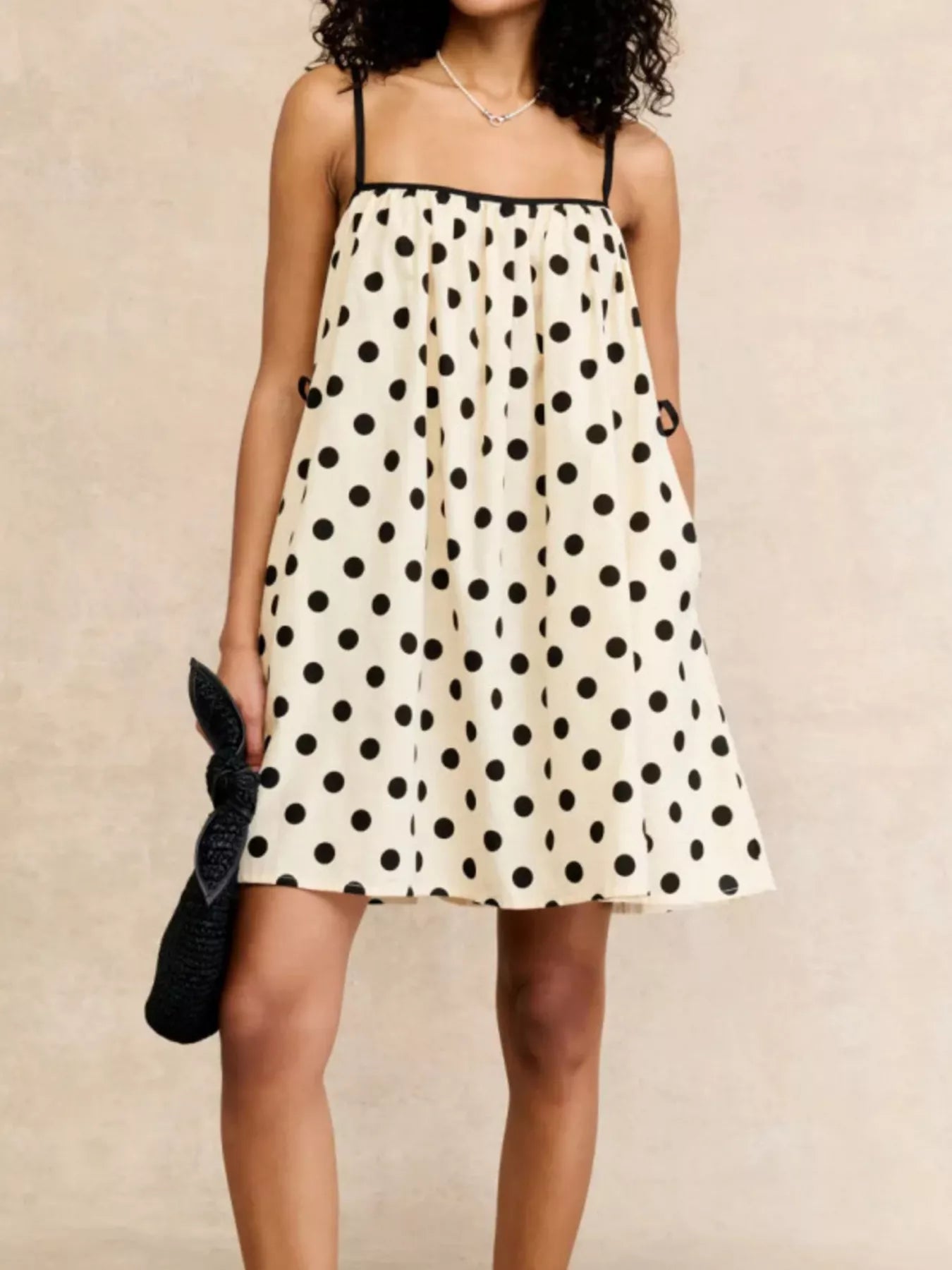 Polka dot spaghetti strap mini dress from Plush Fashion Hub featuring a playful pattern and lightweight fabric.