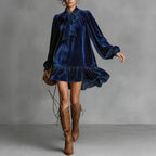 Women’s bow-tie puff sleeve dress by FitiqueFit featuring an asymmetric ruffle hem and short, casualwear style.