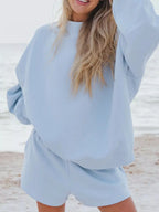 Plush Fashion Hub relaxed fit round neck sweatshirt and shorts set, casual 2-piece loungewear in soft fabric.