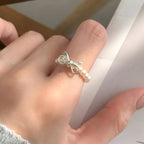 Shopimist Bow Pearl Beaded Ring featuring delicate pearl beads and a charming bow design, perfect for elegant jewelry styling.