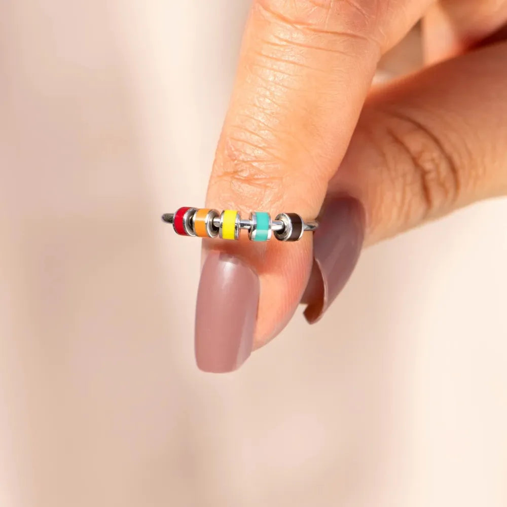 Sterling silver oil drip ring from Shopimist showcases a sleek, modern design with a shiny, polished finish on a plain background.