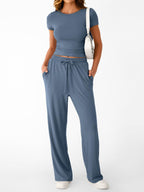 Women's round neck short sleeve T-shirt and drawstring lounge set, casual 2-piece set by Trendsi, shown in relaxed fit and soft fabric.