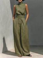 Sleeveless turtleneck top and wide-leg pants set by Trendsi, featuring a fitted turtleneck and flowing wide-leg trousers.