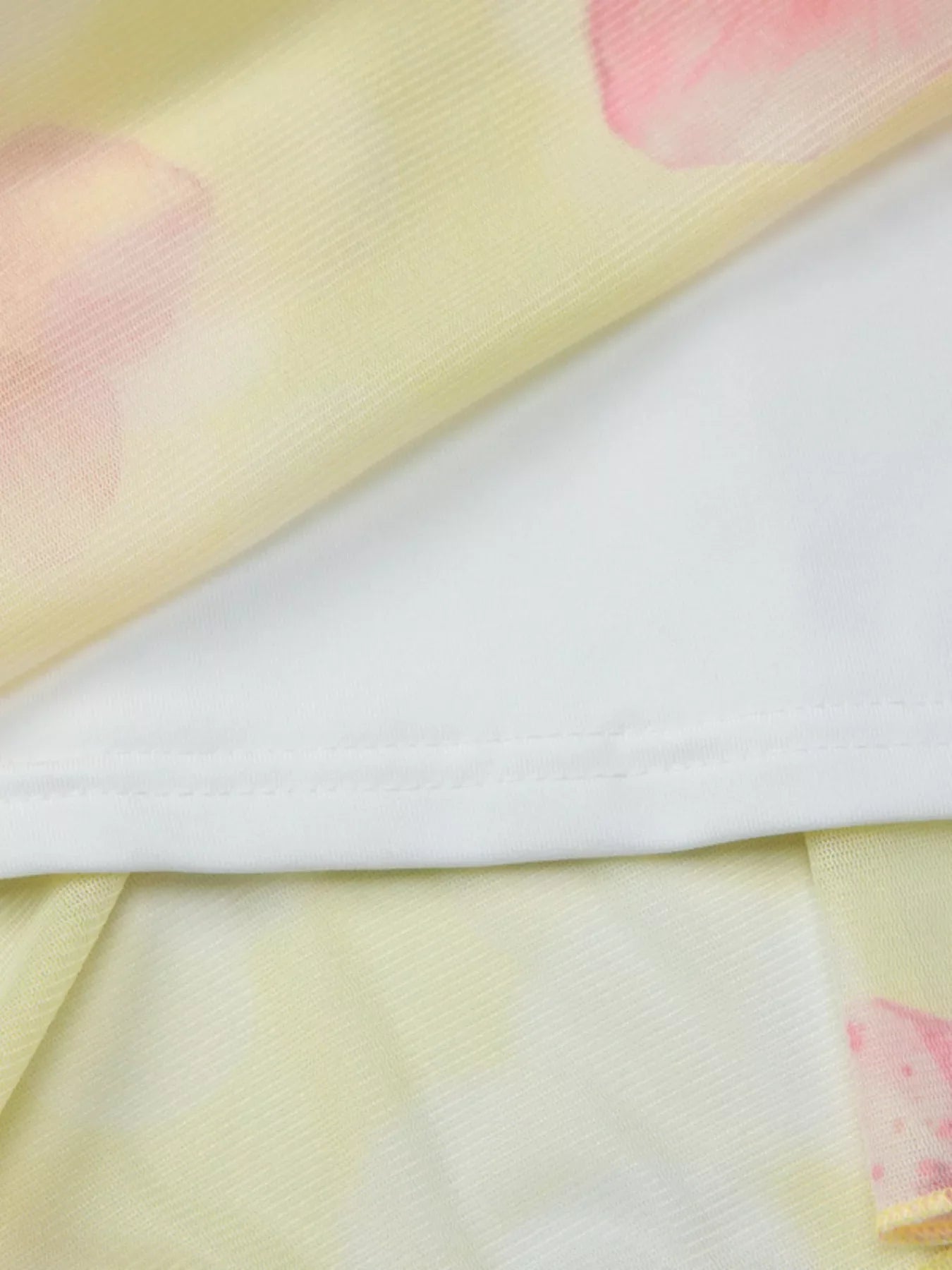 Sheer floral print sleeveless asymmetrical mini dress by Shopimist, featuring a lightweight fabric and stylish asymmetrical hem.