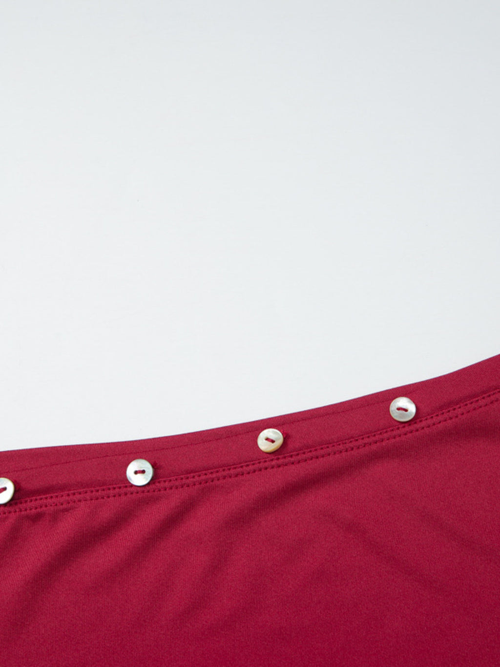 Women's fitted one-shoulder T-shirt with button accents, stylish and casual, from Trendsi.