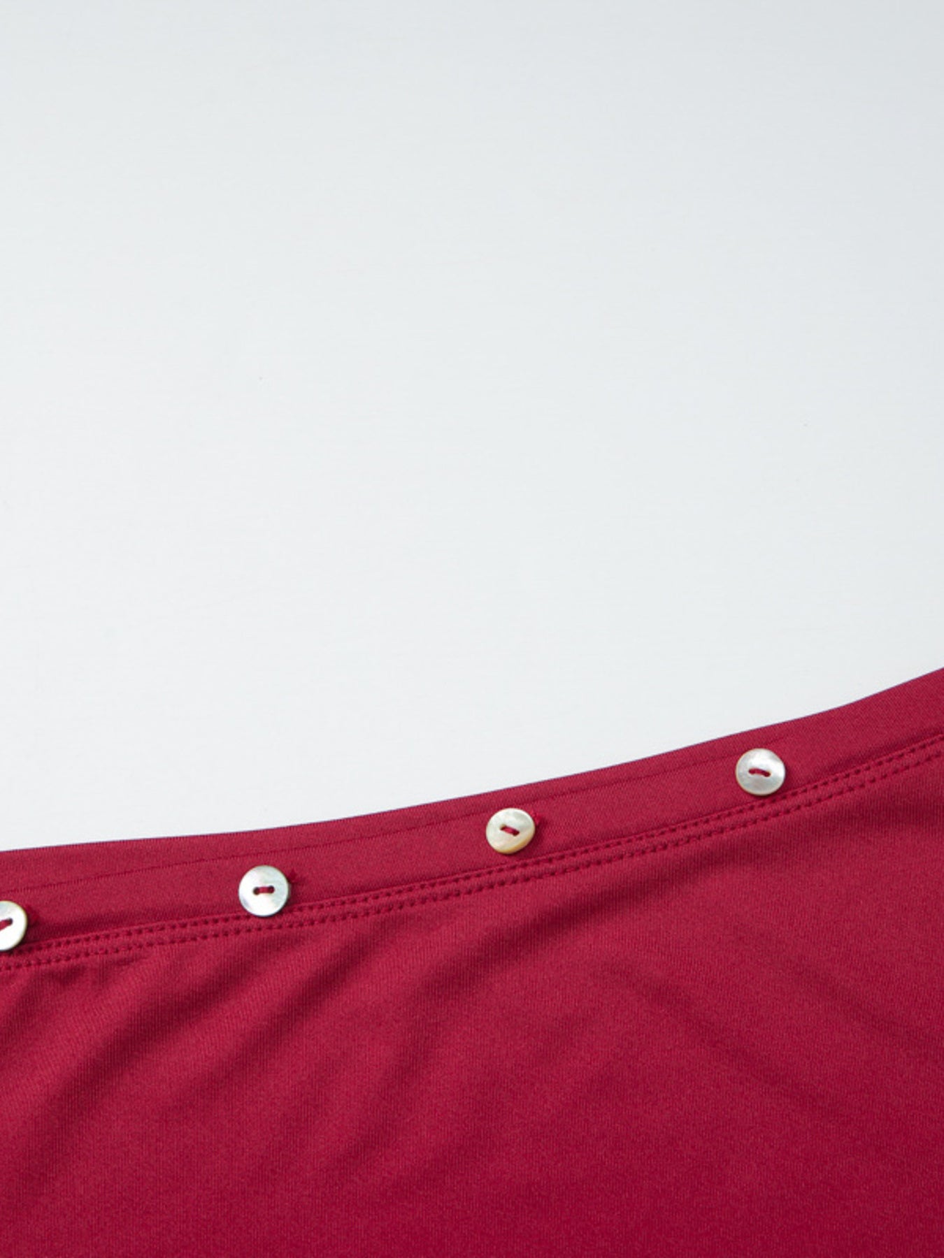 Women's fitted one-shoulder T-shirt with button accents, stylish and casual, from Trendsi.
