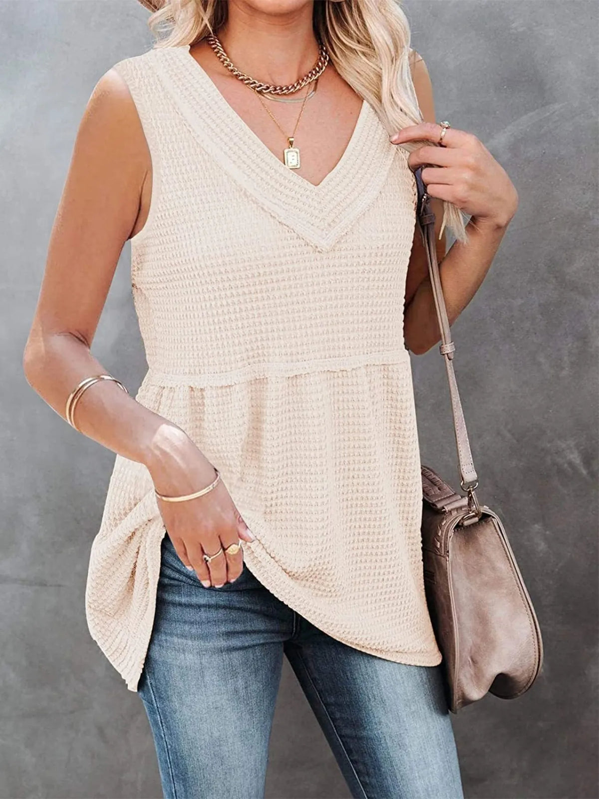 V-neck waffle knit tank top with contrast stitching from Plush Fashion Hub, featuring a fitted sleeveless design and textured fabric.