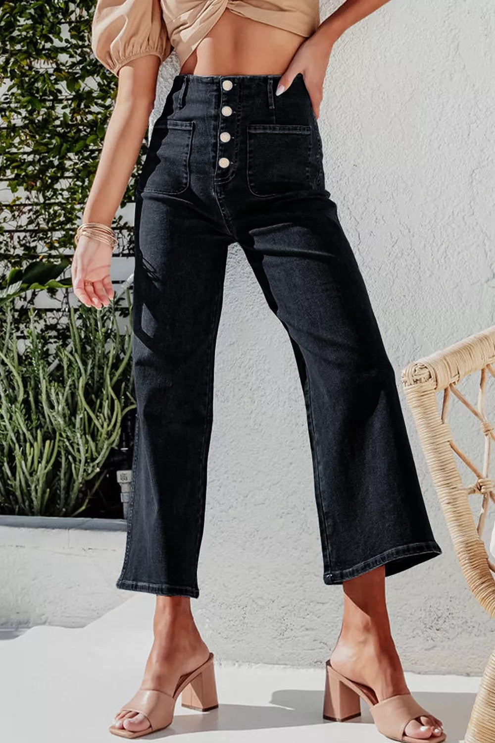 High-waisted button-fly wide-leg jeans from Trendsi, featuring classic denim with a relaxed fit and stylish design.