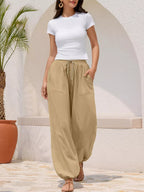 Casual loose fit harem joggers with drawstring waist from Trendsi, featuring relaxed style and comfortable fit in soft fabric.