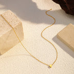 18K gold-plated heart pendant necklace with delicate chain, designed by Shopimist, showcasing a shiny, elegant jewelry piece.