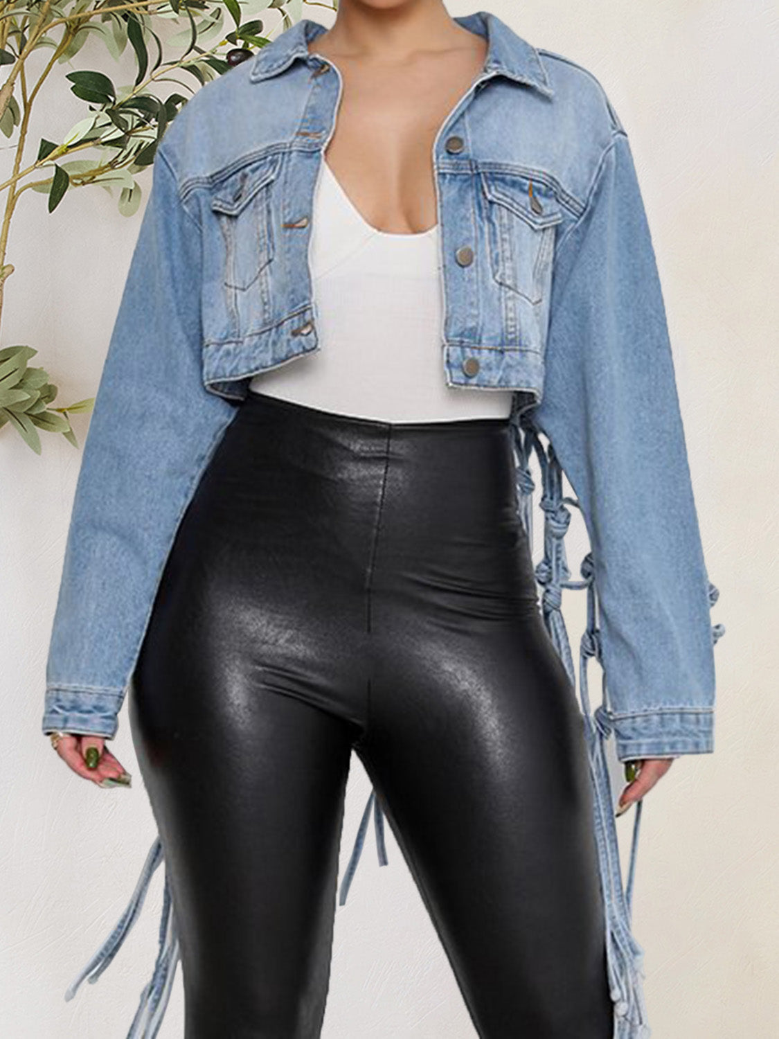Blue denim jacket with tie detail and front pockets from Plush Fashion Hub, featuring button-up closure and stylish design.