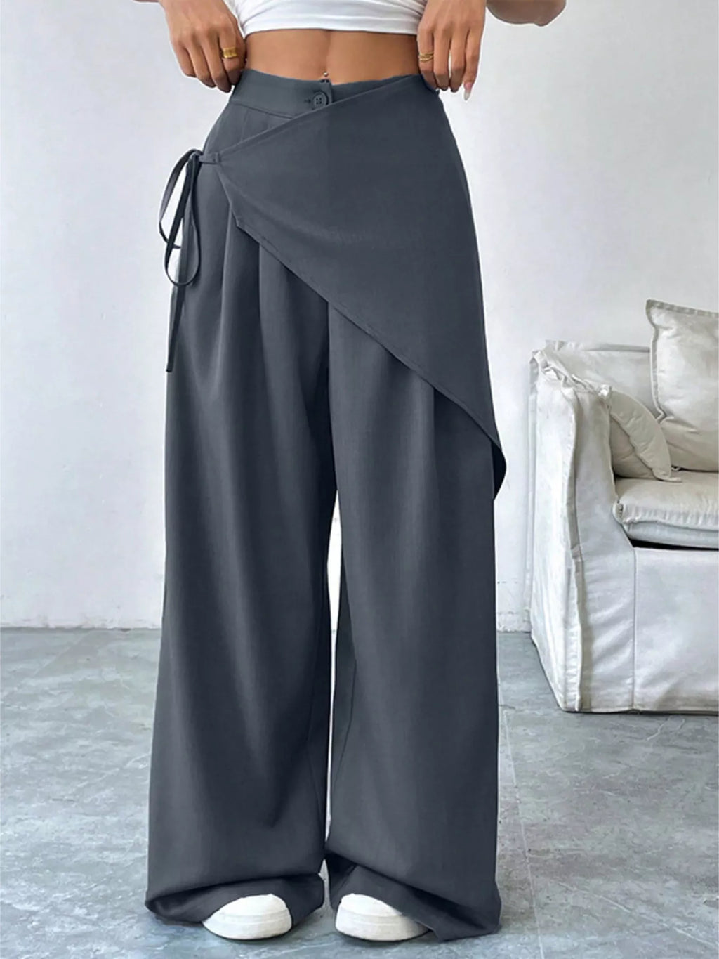 Asymmetrical wrap wide-leg pants from Plush Fashion Hub, featuring a stylish design and flowing silhouette.