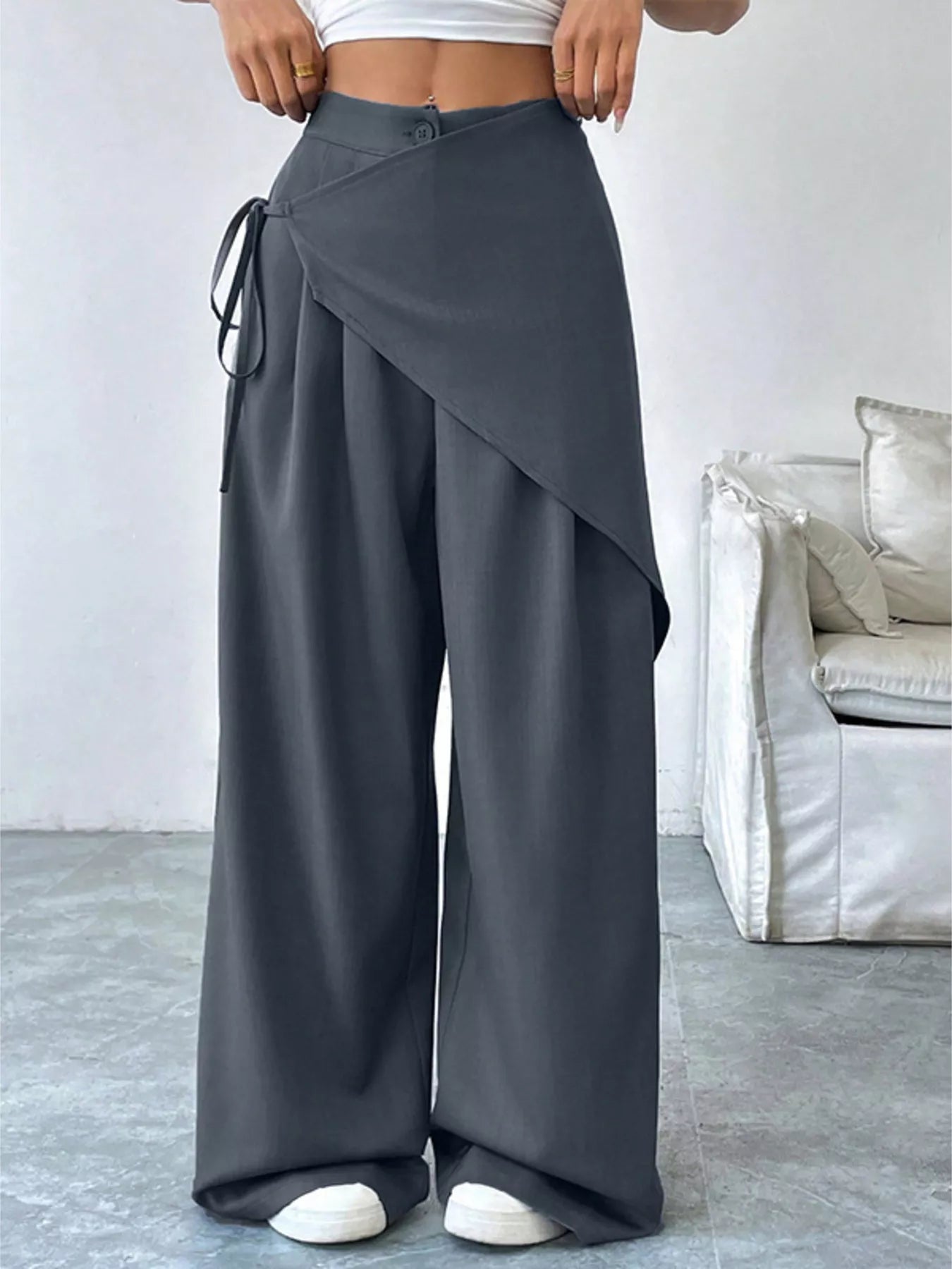 Asymmetrical wrap wide-leg pants from Plush Fashion Hub, featuring a stylish design and flowing silhouette.