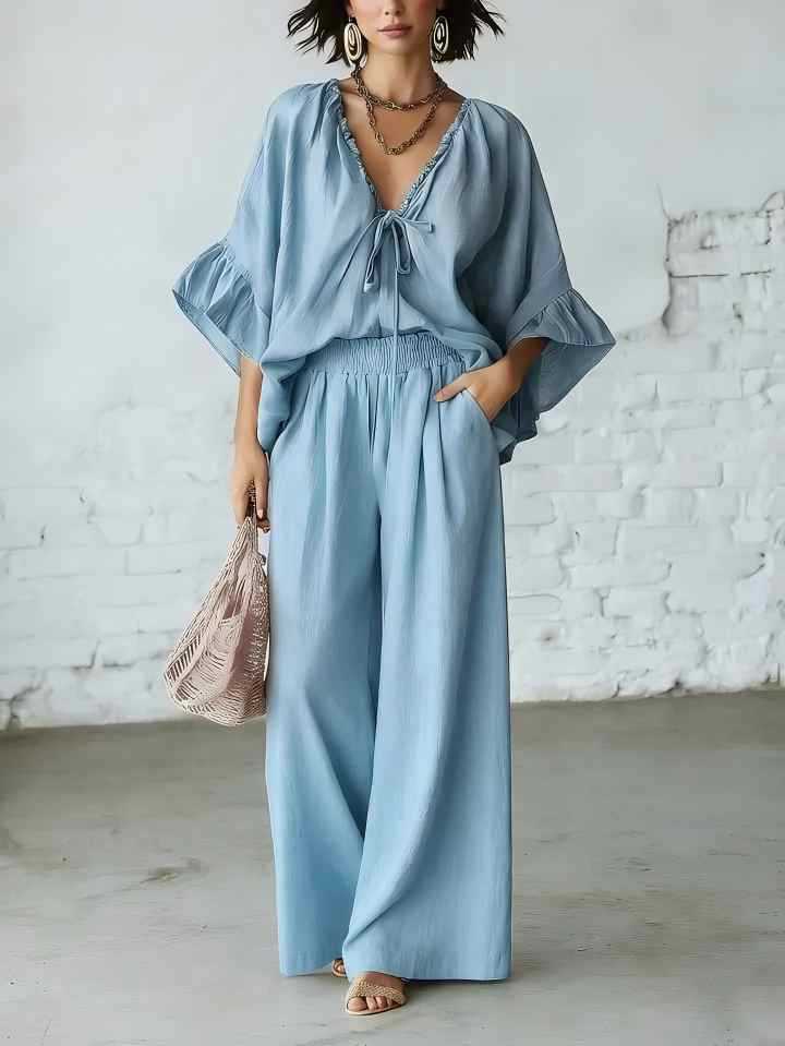 Women's casual two-piece set with V-neck top and wide-leg pants from Plush Fashion Hub, shown in a relaxed fit and soft fabric.