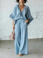 Women's casual two-piece set with V-neck top and wide-leg pants from Plush Fashion Hub, shown in a relaxed fit and soft fabric.