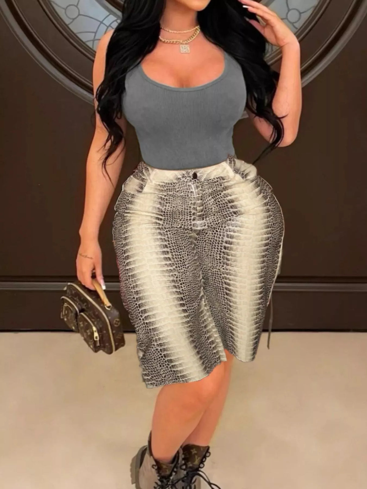 Trendsi snake print high-waisted capris for women, featuring a stylish snake skin pattern and a fitted high-rise design.
