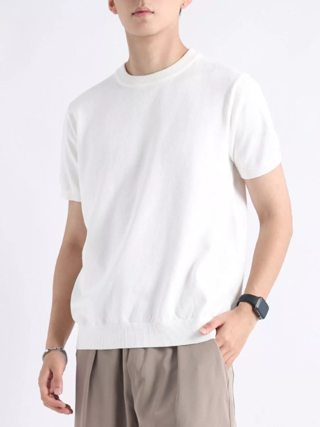 Men's plus size casual knitted short sleeve T-shirt from Trendsi, featuring a comfortable fit and soft fabric in a neutral color.