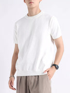 Men's plus size casual knitted short sleeve T-shirt from Trendsi, featuring a comfortable fit and soft fabric in a neutral color.