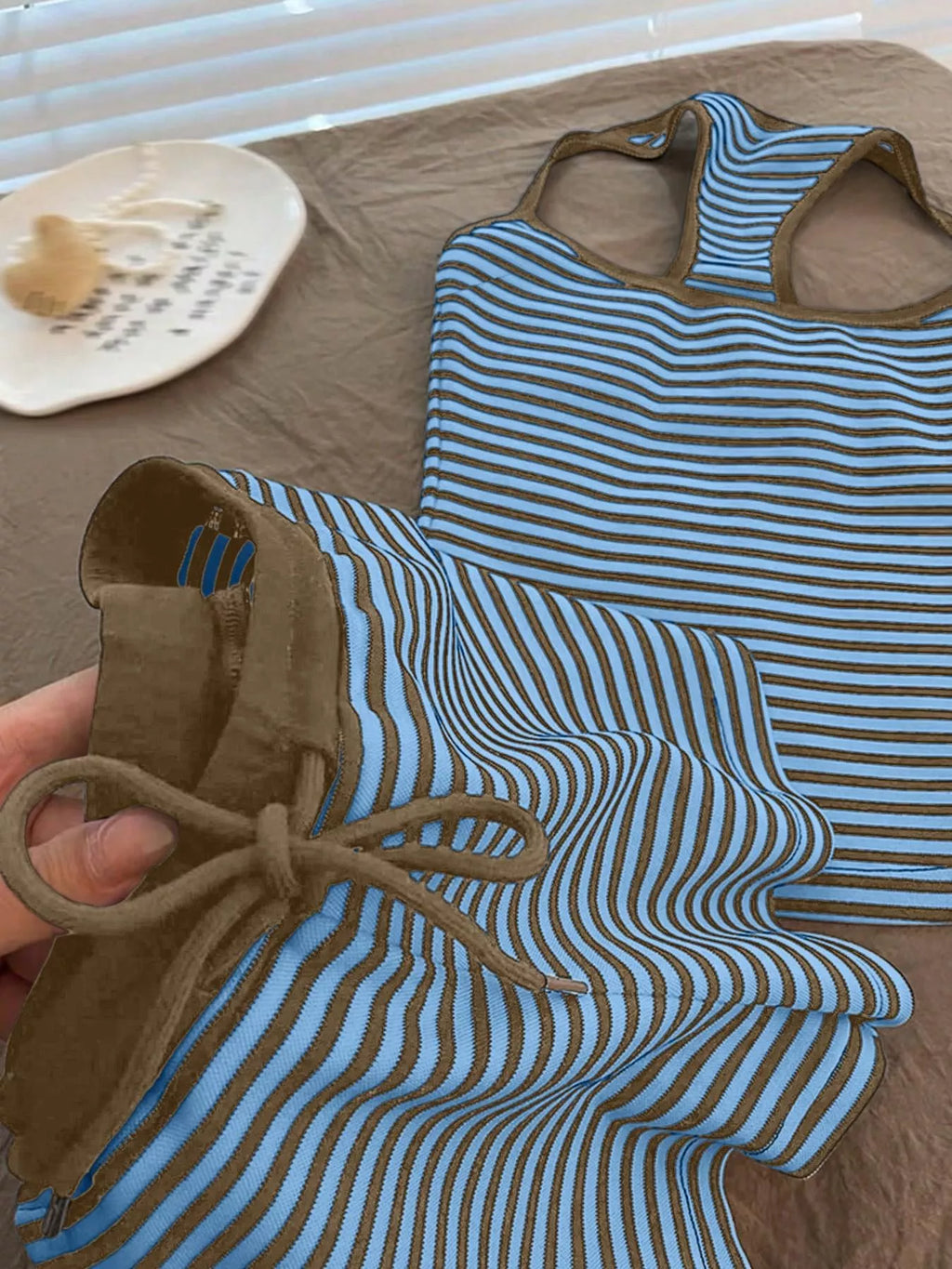Striped tank top and shorts set by Trendsi, featuring a casual summer look with comfortable fabric and stylish striped design.