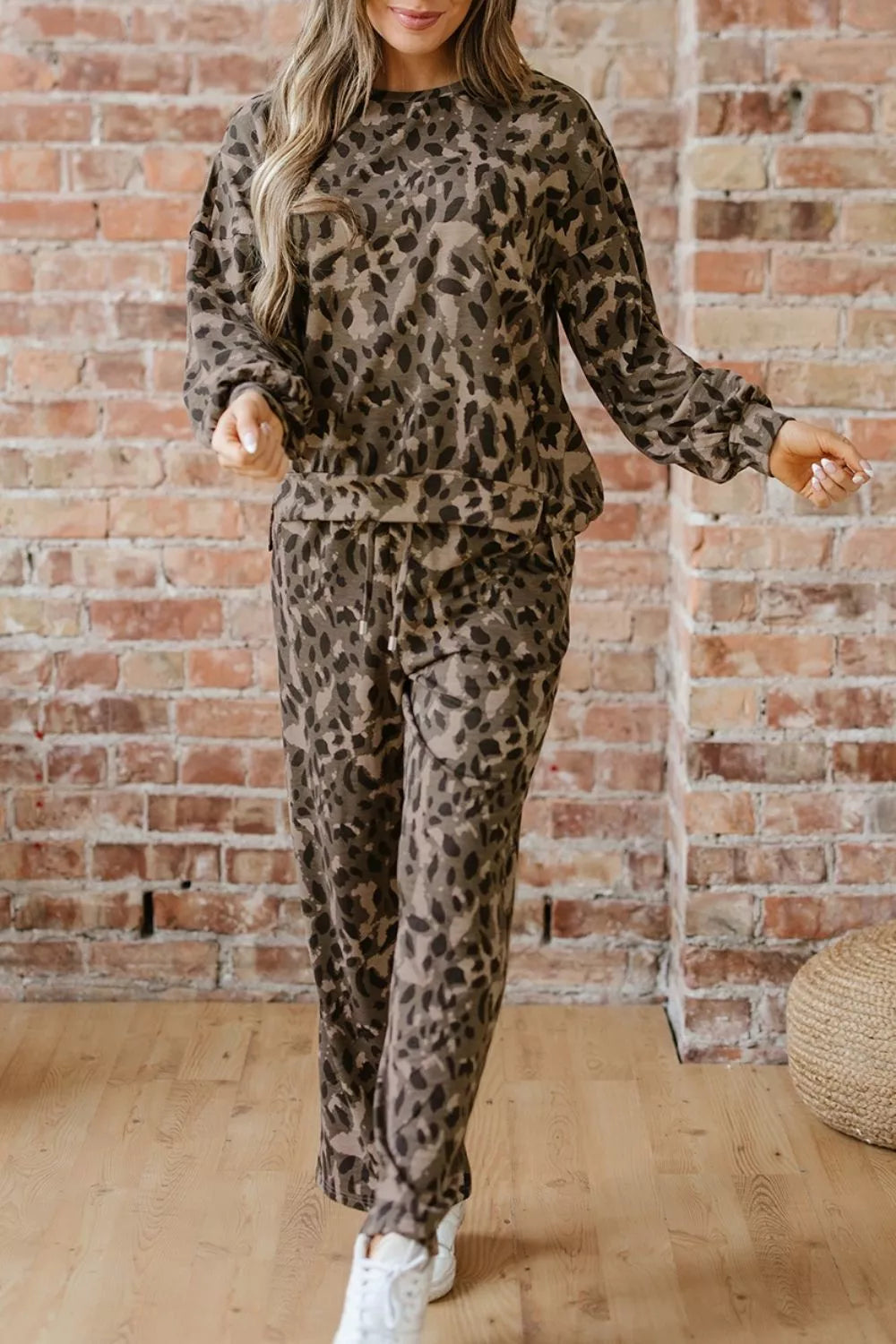 Leopard print long sleeve top and matching pants set by Trendsi, featuring a stylish, coordinated animal print outfit.