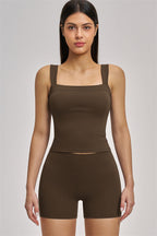 Fitglutes Activewear two-piece tank top and shorts set for gym and workout, featuring breathable fabric and sporty design.