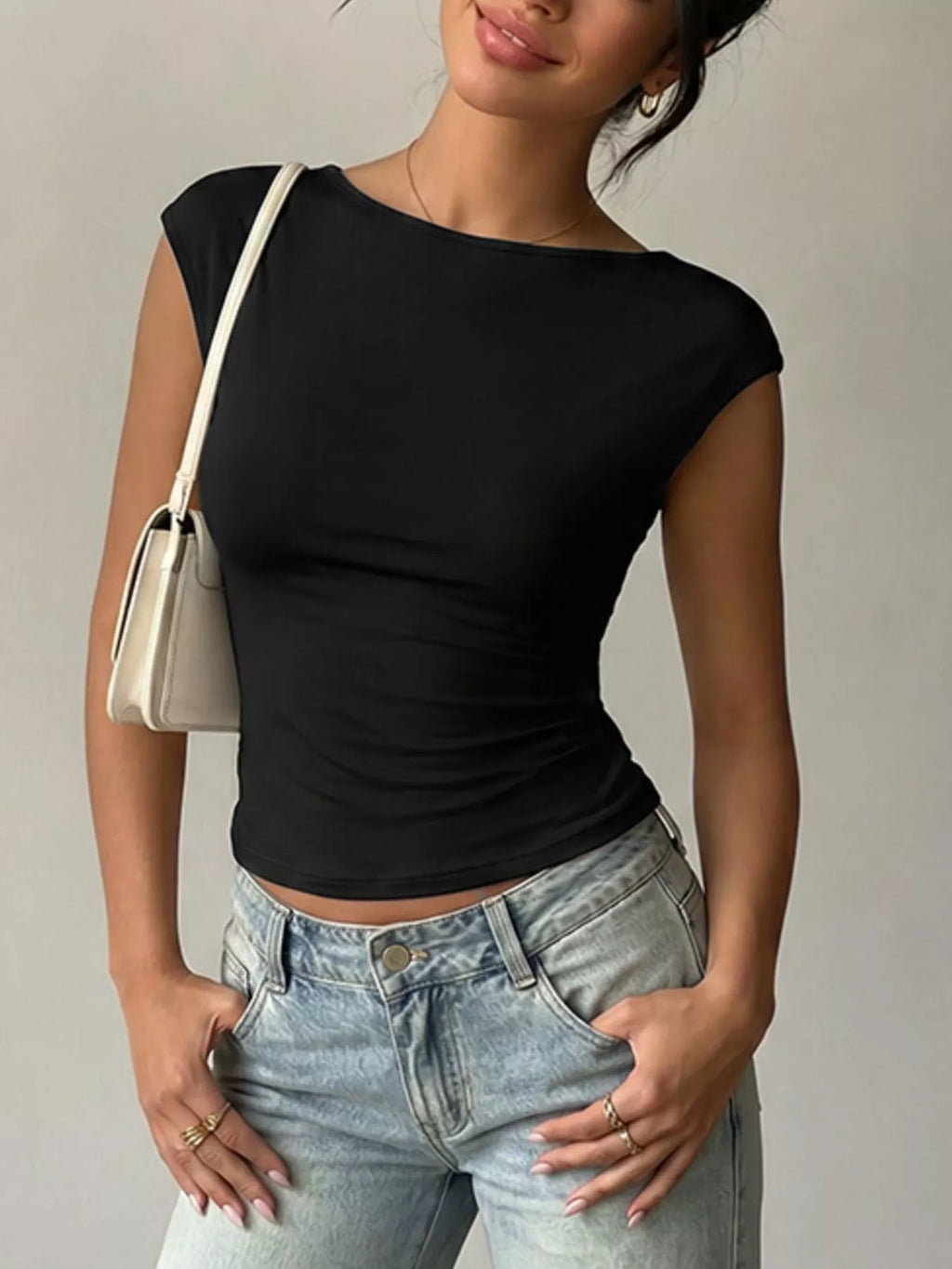 Lace detail cap-sleeve T-shirt from Trendsi, featuring a classic design with delicate lace accents on the sleeves.